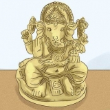 Pregare il dio indù ganesha