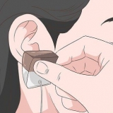 Riduci il dolore causato da un nuovo piercing